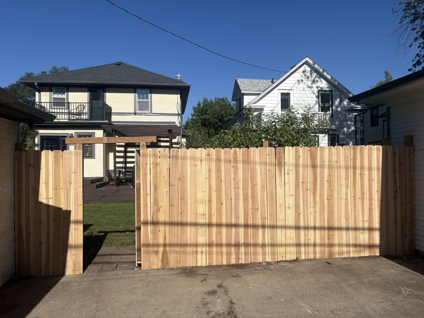 After: brand new cedar privacy fence with gate in the same alley