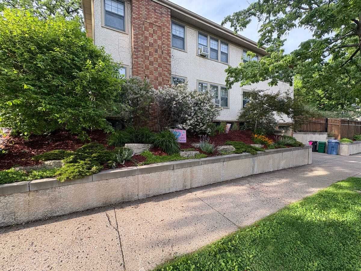 Terraced retaining wall with fresh plantings and mulch