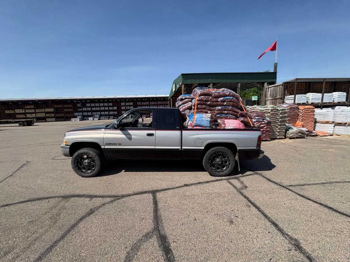 Truck loaded with bags of mulch for delivery